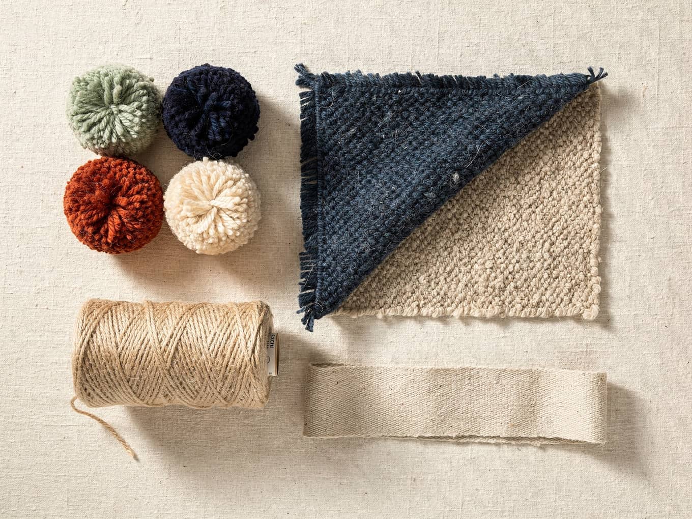 Wool yarn pom colour samples, a runner corner sample and cotton backing: the options a mill prices per piece