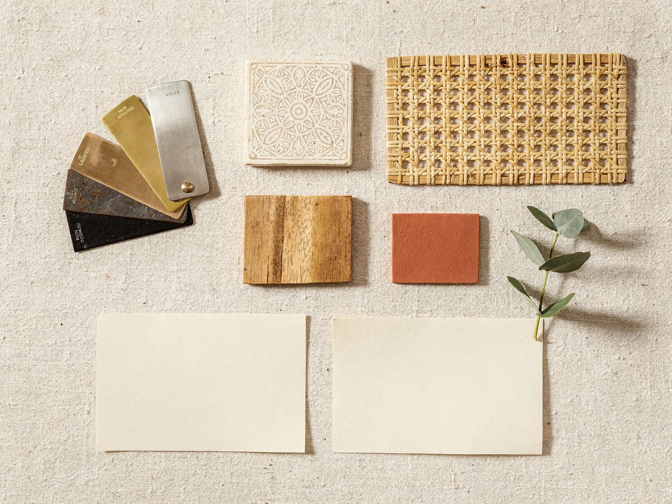 An exporter’s mood board: brass, nickel and iron finish chips, a bone-inlay sample, a terracotta paint chip, rendered
