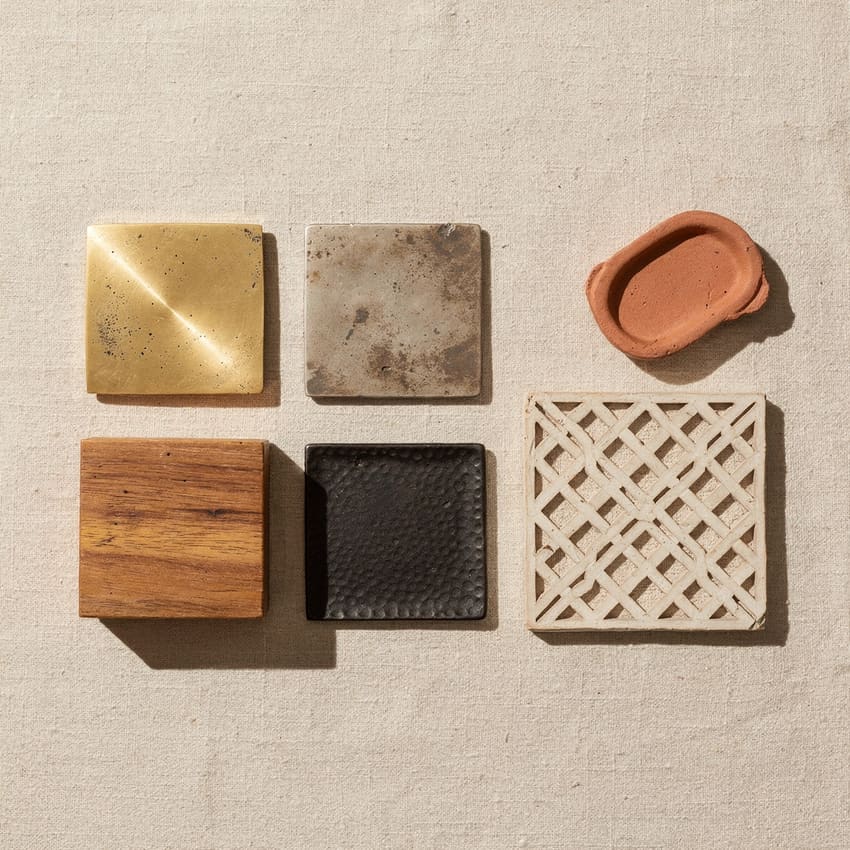 Material-family board: brass, nickel and iron samples with a mango-wood block and bone inlay, rendered